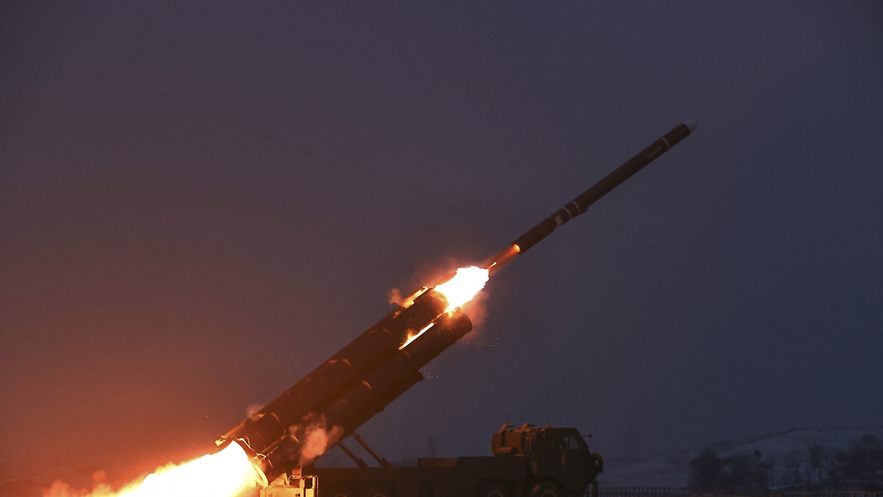 NKorea Fires Cruise Missiles, Kim Vows Nuclear Buildup